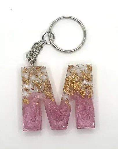 Pink resin letter M keychain with gold flakes